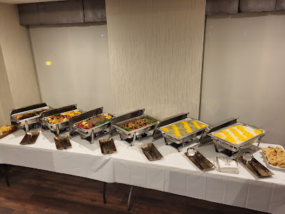 Table full of metal trays of Persian food in Oak Ridges Richmond Hill Ontario