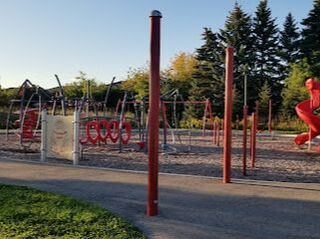 Red playground structure in Yongehurst, Richmond Hill, Ontario