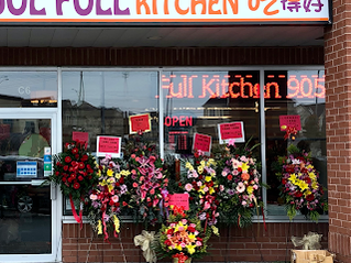 Front entrance of a restaurant with a large bouquet of flowers in Headford, Richmond Hill Ontario